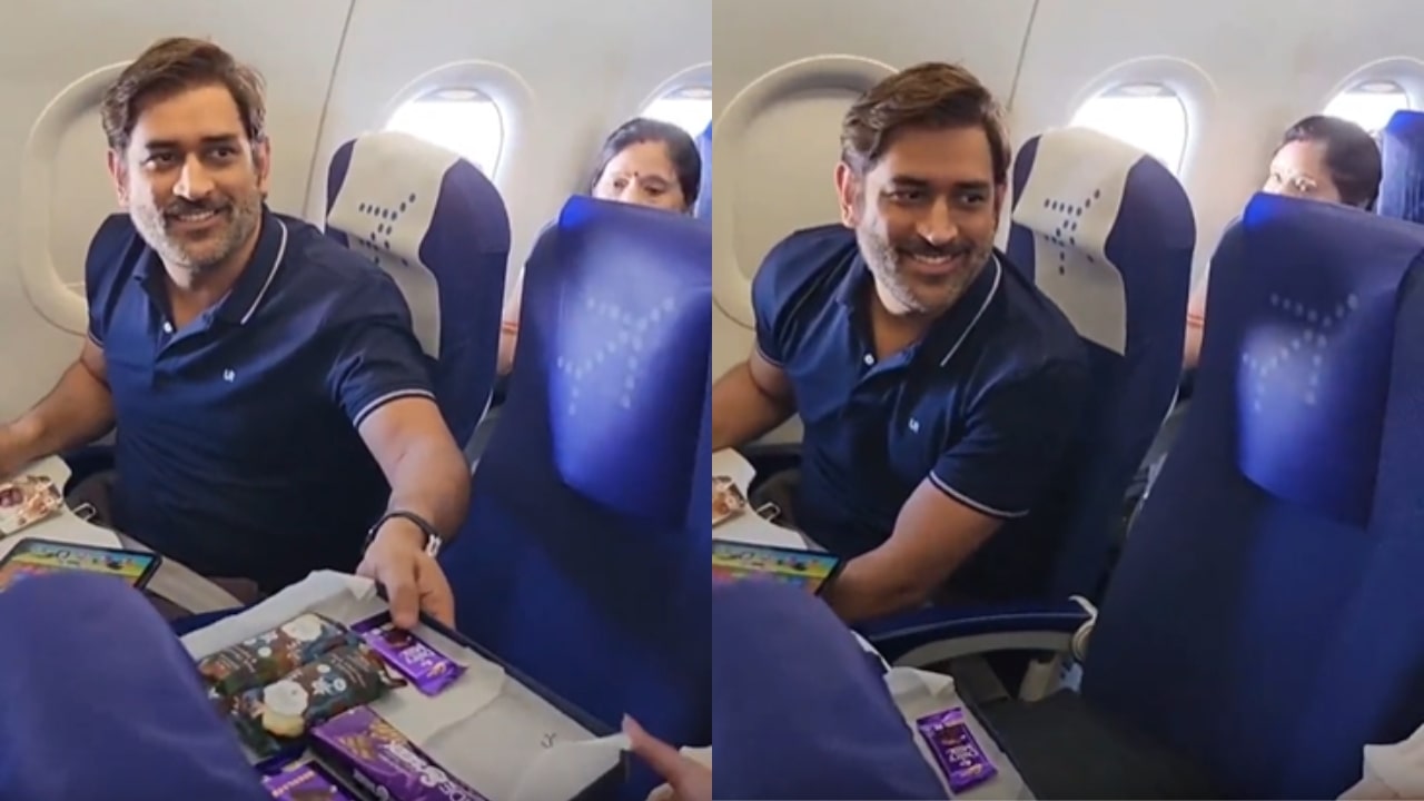Air Hostess Gifts Chocolate To MS Dhoni