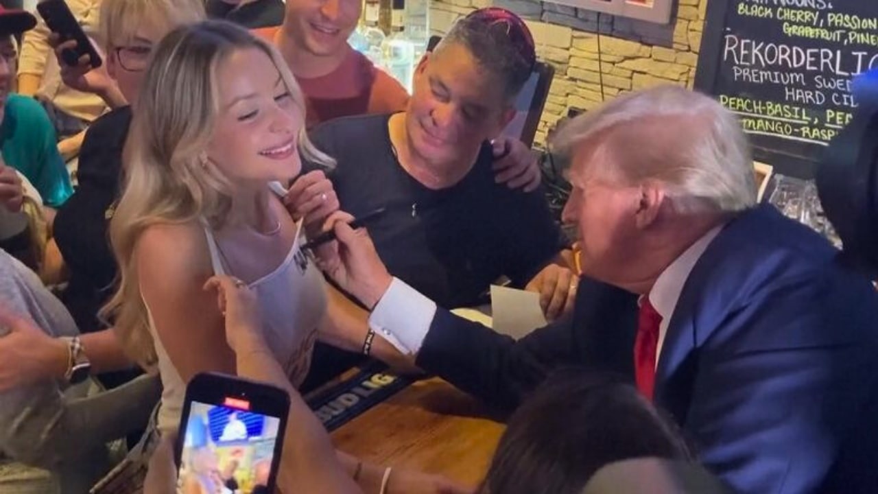 Donald Trump Signs Woman Top