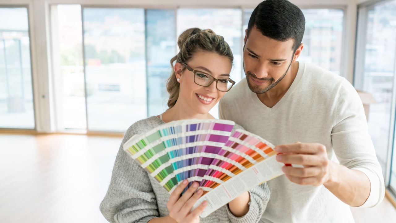 Couple Painting Their House